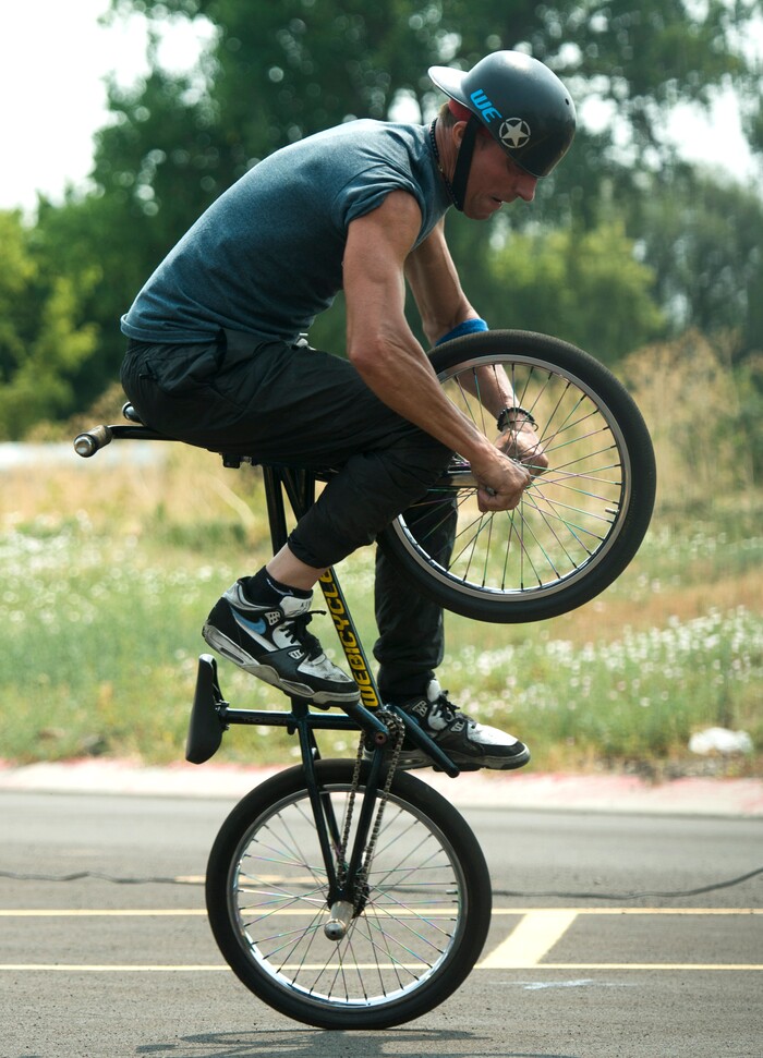 (Rick Egan  |  The Salt Lake Tribune)    Pete Brandt performs a bike trick, during the BMX Stunt Show, at the Davis County Fair in Farmington, Saturday, Aug. 18, 2018.