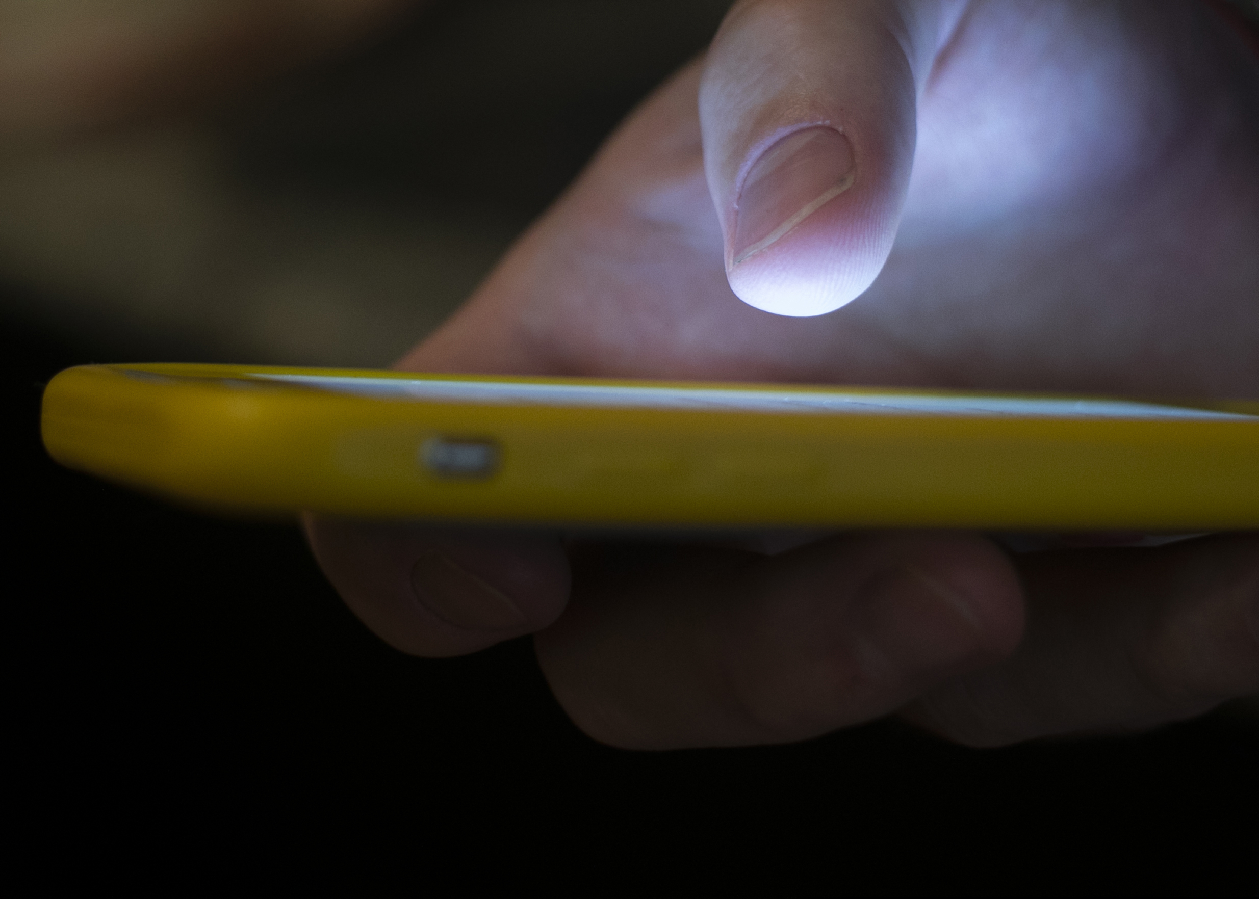 FILE - In this Aug. 11, 2019, file photo, a man uses a cell phone in New Orleans. (AP Photo/Jenny Kane, File)