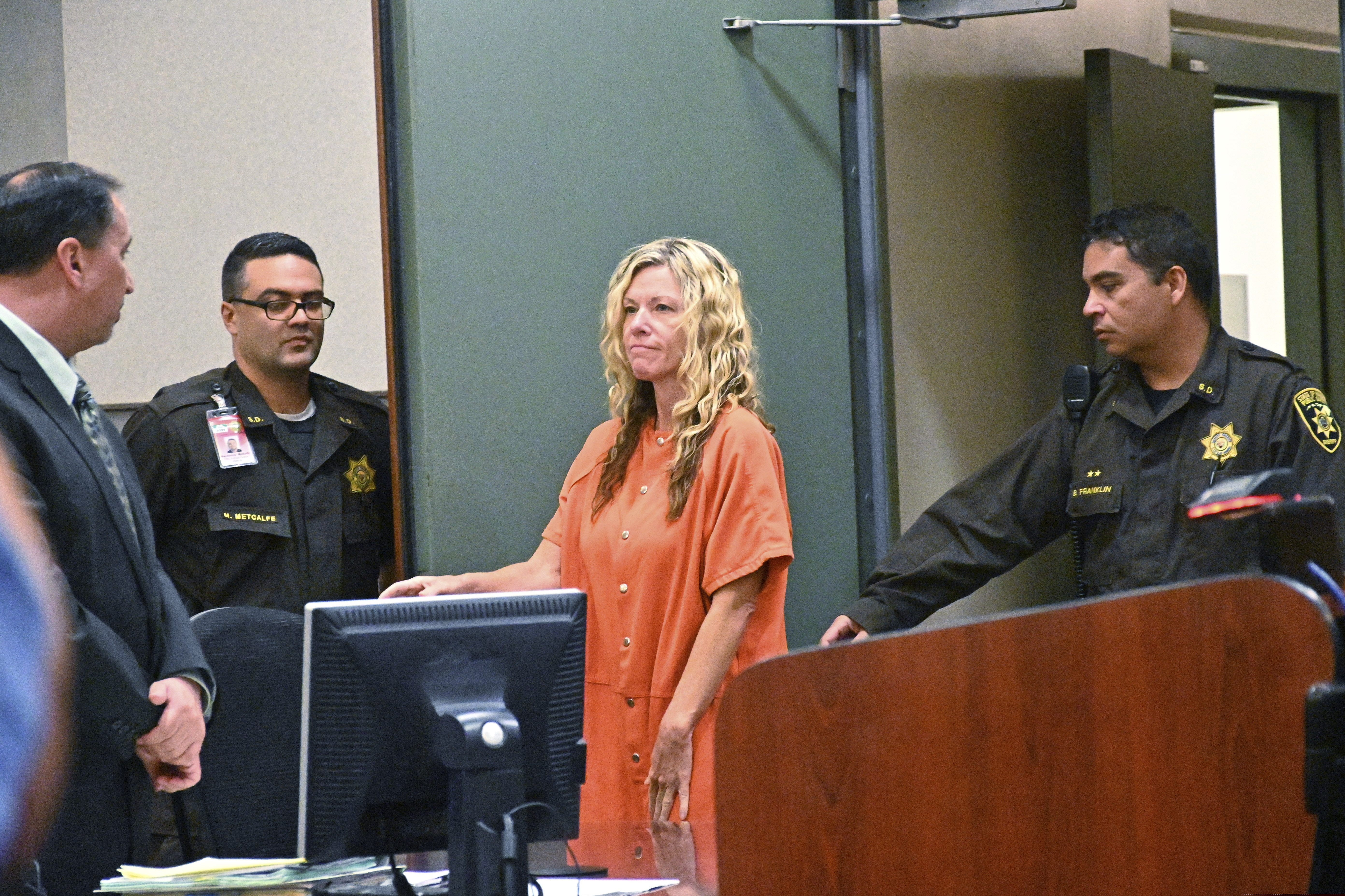 (Dennis Fujimoto | The Garden Island via AP, pool) Lori Vallow appears in court in Lihue, Hawaii on Wednesday, Feb. 26, 2020. A judge ruled that bail will remain at $5 million for Vallow, also known as Lori Daybell, who was arrested in Hawaii over the disappearance of her two Idaho children. Vallow requested a hearing so the judge would consider a reduced bail. After the judge denied the request, her defense attorney, Craig De Costa, left, said she is waiving an extradition hearing, which had been scheduled for March 2. Kauai Prosecutor Justin Kollar said he will work with Idaho authorities on logistics for her departure.