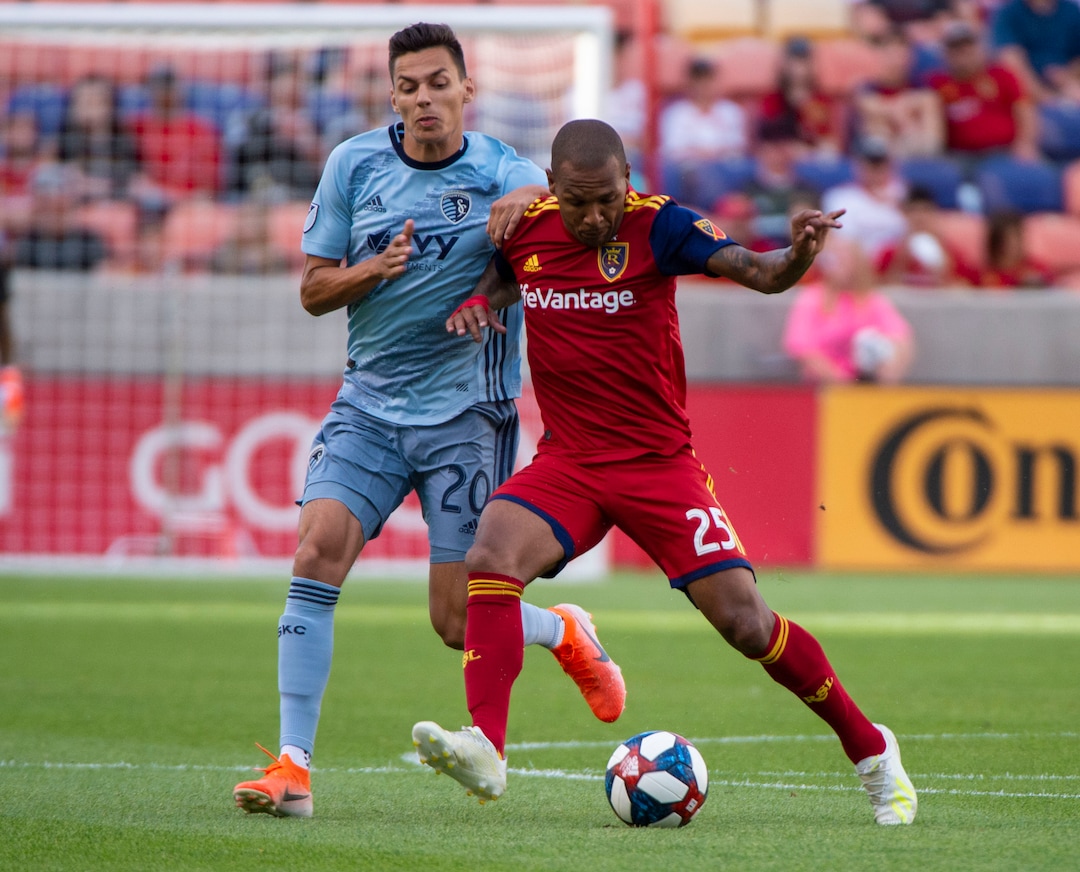 (Rick Egan  |  The Salt Lake Tribune)  Real Salt Lake midfielder Sebastian Saucedo (23) collides with Sporting Kansas City forward Daniel Salloi (20), in MLS soccer action between Real Salt Lake and Sporting Kansas City, in Sandy, Saturday, June 29, 2019.