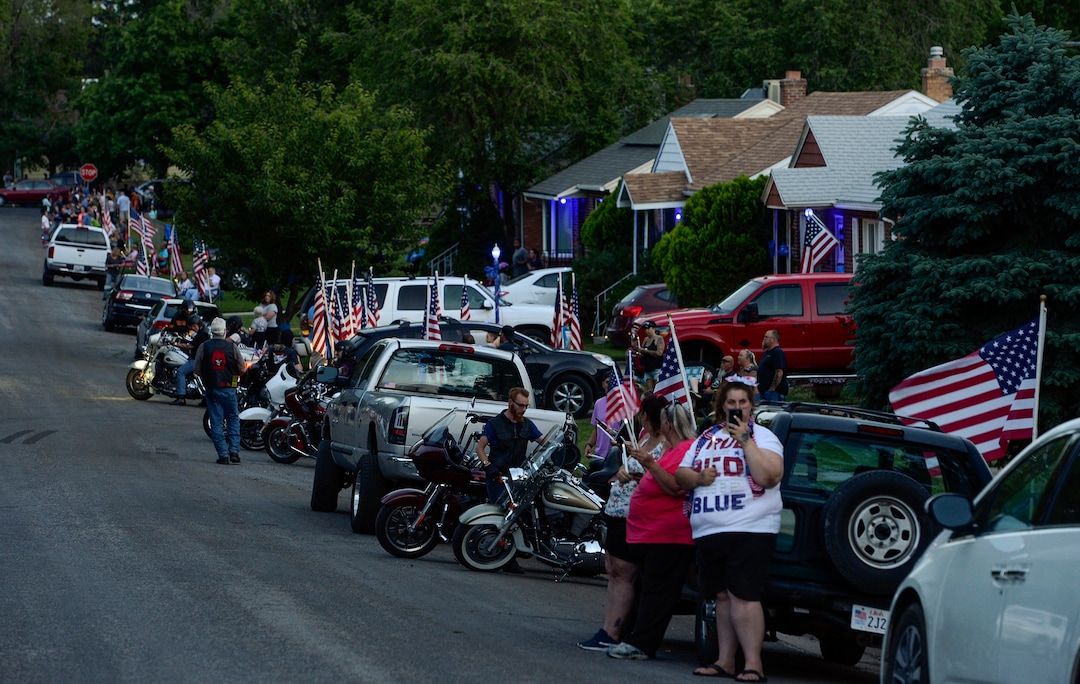 (Leah Hogsten  |  The Salt Lake Tribune) Friends and supporters lined the neighborhood of Officer Nate Lyday's childhood home on Custer Avenue in Ogden prior to the Memorial Procession and Community Vigil in honor of Lyday's life. The procession made its way through five other Ogden landmarks before ending at Lindquist Field.