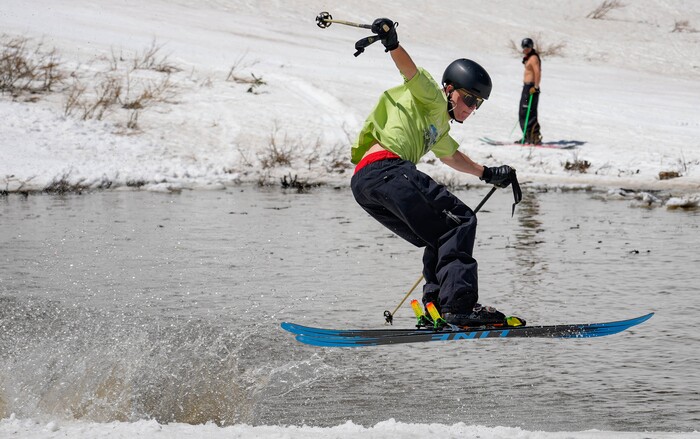 (Francisco Kjolseth  | The Salt Lake Tribune) Will Johnson pops out of the pond in style in Peruvian Gulch as Snowbird closes the book on the 2024-25 ski season on Monday, May 26, 2025. Snow and sun revelers took to the slushy slopes on Memorial Day as the resort was the last in the state to close.