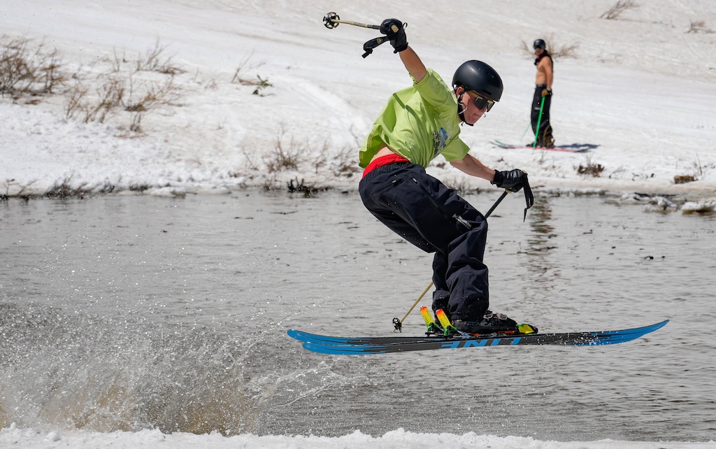 (Francisco Kjolseth | The Salt Lake Tribune) Will Johnson pops out of the pond in style in Peruvian Gulch as Snowbird closes the book on the 2024-25 ski season on Monday, May 26, 2025. Utah's resorts have begun announcing their opening dates for the 2026-27 season.