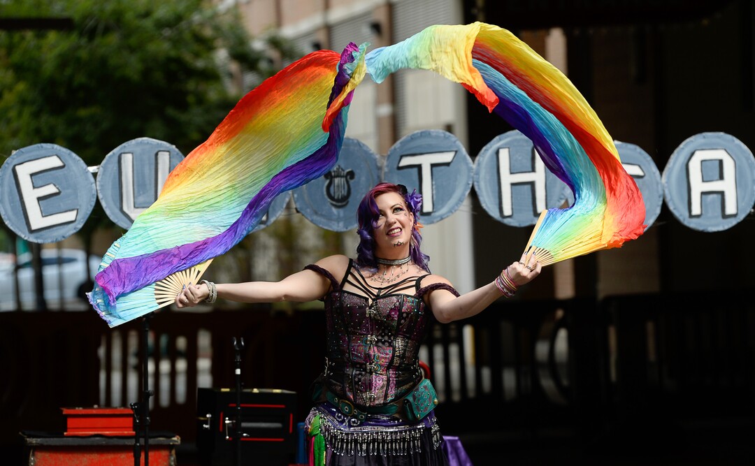 (Francisco Kjolseth  |  The Salt Lake Tribune)  Magician Celeste McCulley gets ready to perform as she draws in the audience with colorful dance as the Salt Lake Arts Council presents the first Busker Fest, featuring entertainers, dancers, musicians, magicians, jugglers, and comedy along Regent Street in downtown Salt Lake City on Friday, Aug. 24, 2018. Celebrating the tradition of street performance and observing the city's vaudeville roots, young and old were drawn in to observe and participate. 