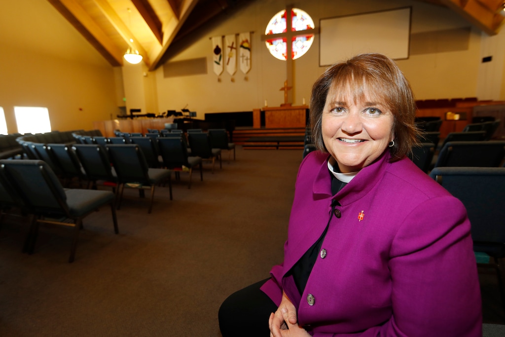 (David Zalubowski | AP file foto)This April 19, 2017, photo shows Bishop Karen Oliveto in the sanctuary of a United Methodist Church near her office in Highlands Ranch, Colo.