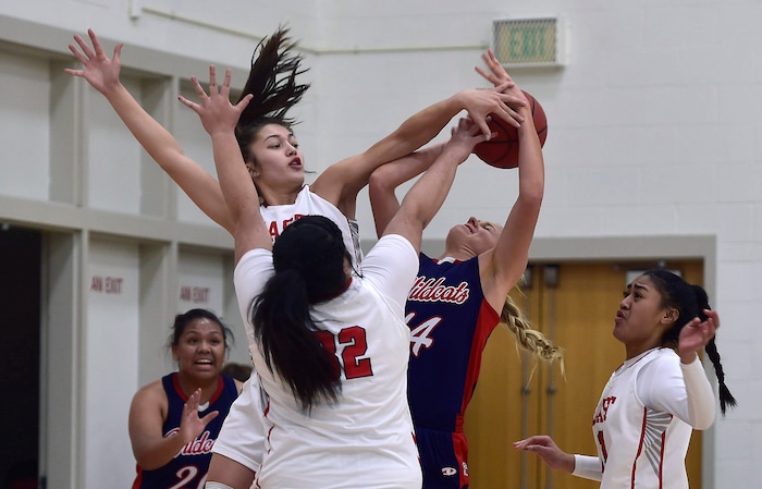 (Scott Sommerdorf   |  The Salt Lake Tribune)   East's Rae Falatea blocks Rachel Noel's shot during first half play. East beat Woods Cross 50-36, Friday, December 15, 2017.  