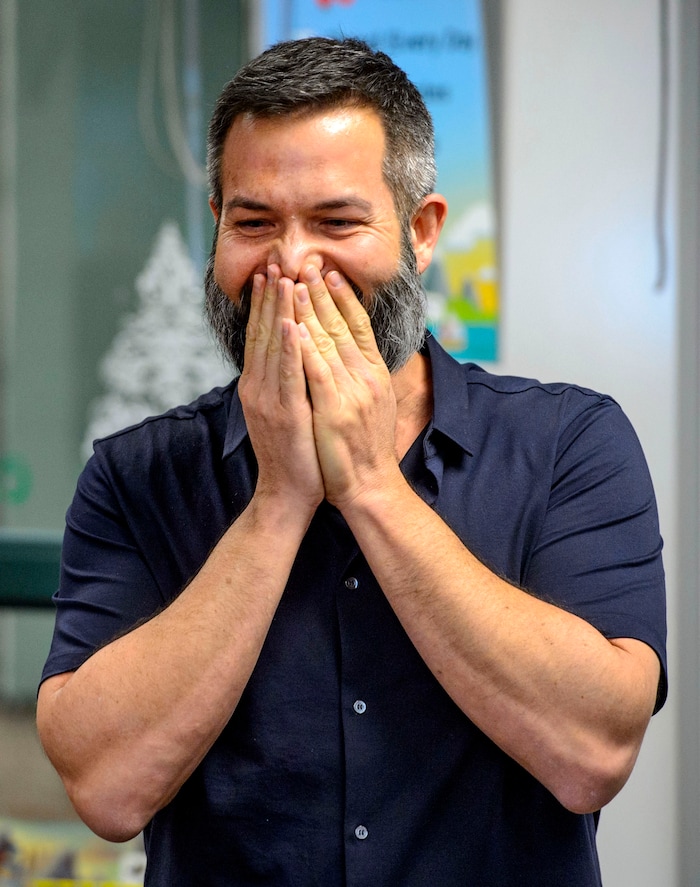 (Steve Griffin  |  The Salt Lake Tribune)  Franklin Elementary School special education teacher Jason Adam Tackett is surprised by Karen Huntsman, as she made the announcement  that he has won the Huntsman Award for Excellence in Education, during the school's faculty meeting in Salt Lake City Monday April 23, 2018. With the award comes a $10,000 cash prize.