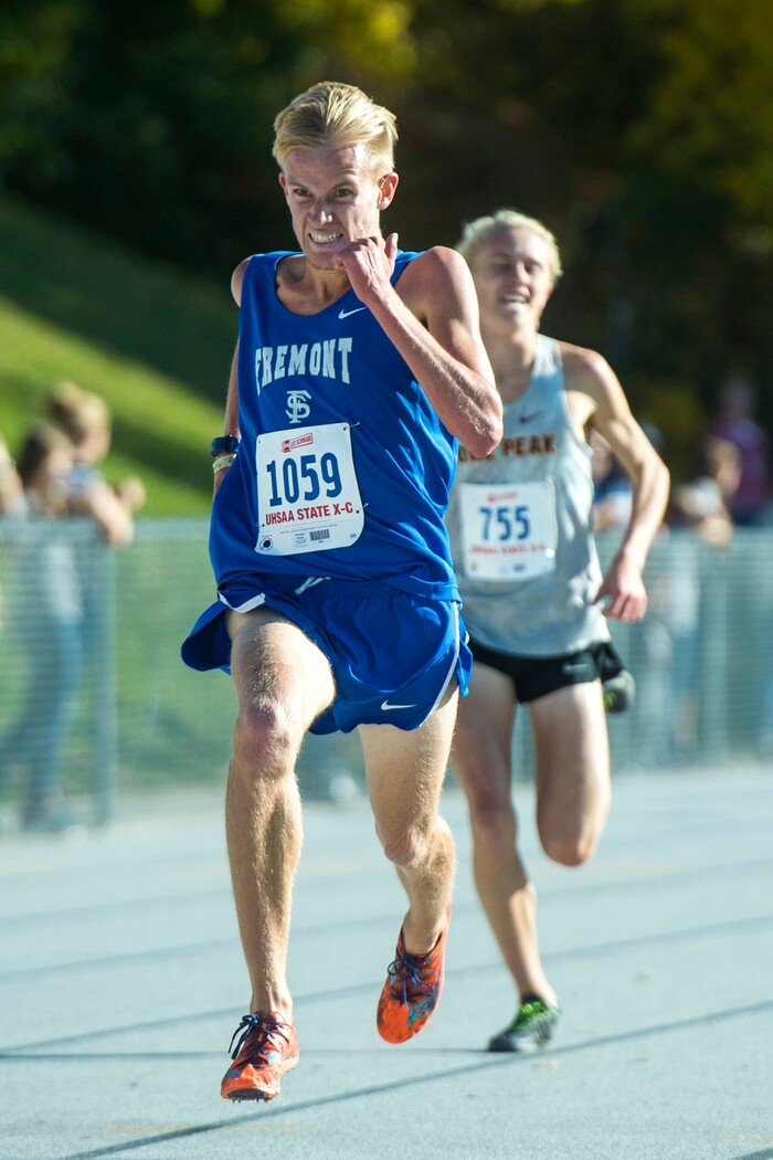 (Chris Detrick  |  The Salt Lake Tribune) Fremont senior Bronson Winter passes Lone Peak senior Justin Hartshorn to win the 6A boy's state cross-country meet with a time of 15:09.3 at Sugar House Park and Highland High School Wednesday, October 18, 2017. 