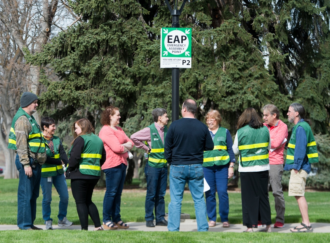 (Rick Egan  |  The Salt Lake Tribune)   Emergency response captains wear their green vests as they meet at an emergency assembly point in Presidents Circle on the University of Utah campus, during the Great Utah ShakeOut Annual Statewide Earthquake Drill Thursday, April 19, 2018.