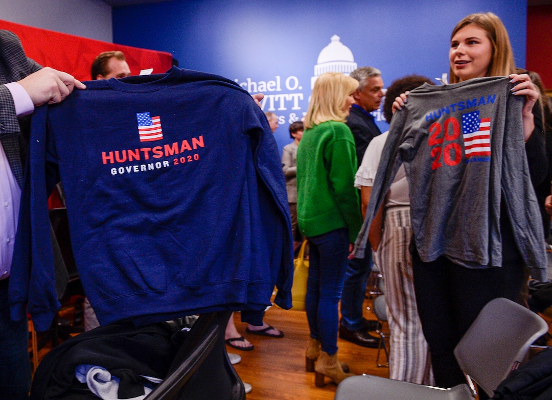 (Leah Hogsten  |  The Salt Lake Tribune) A Jon Huntsman campaign staff member shows off Huntsman campaign shirts on Thursday. Former two-term Gov. Jon Huntsman, 59, announced his bid for governor, Nov. 14, 2019. Huntsman fielded questions after an appearance at the Michael O. Leavitt Center for Politics and Public Service at Southern Utah University in Cedar City on Thursday.