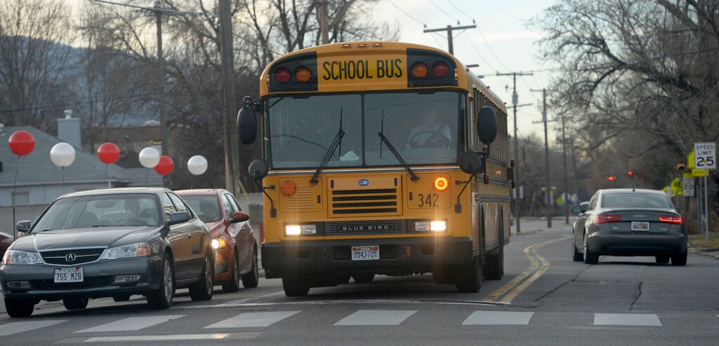 (Al Hartmann | Tribune file photo) A school bus at an intersection in Salt Lake City.