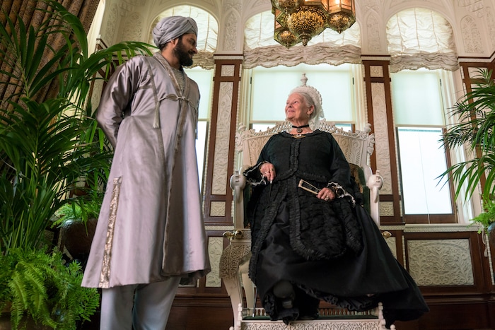 (Peter Mountain  |  courtesy Focus Features) Queen Victoria (Judi Dench, right) talks with Abdul Karim (Ali Fazal), an Indian Muslim who became her confidant in her final years, in director Stephen Frears’ "Victoria and Adbul."