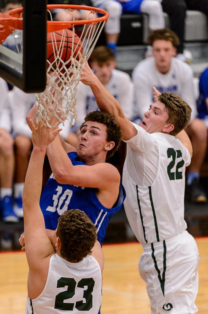 (Trent Nelson | The Salt Lake Tribune)  Bingham's Brock Anderson shoots as Olympus faces Bingham, high school boys' basketball at the Utah Elite 8 tournament in American Fork, Thursday December 7, 2017. At right is Olympus's Spencer Jones.