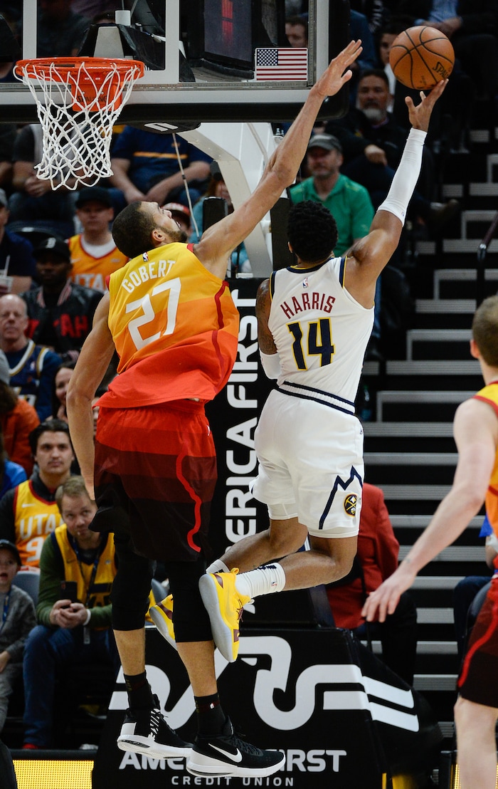(Francisco Kjolseth  |  The Salt Lake Tribune)  Utah Jazz center Rudy Gobert (27) blocks Denver Nuggets guard Gary Harris (14) as the Utah Jazz host the Denver Nuggets in their NBA game at Vivint Smart Home Arena Tuesday, April 9, 2019, in Salt Lake City.