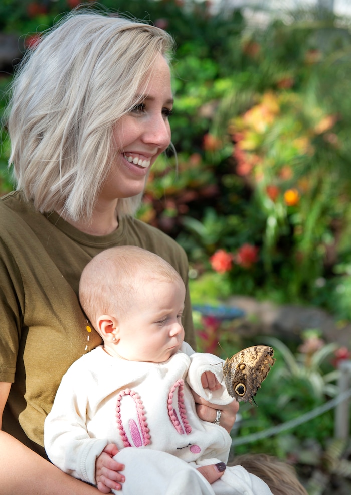 (Rick Egan  |  The Salt Lake Tribune)     
Taylor Chidester holds 5-month-old Linnon, as she looks at the butterfly on her arm, at the Butterfly Biosphere at Thanksgiving Point’s Water Tower Plaza in Lehi. Tuesday, Jan. 22, 2019.  The Butterfly Biosphere is home to more than a thousand butterflies from around the world.  
