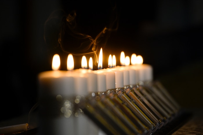 Leah Hogsten | The Salt Lake Tribune Eleven candles, representing those killed during Saturday's shooting at the Tree of Life Synagogue in Pittsburgh, were remembered during an interfaith service at Chabad Lubavitch of Utah, Monday, Oct. 29, 2018. Hundreds attended the vigil and prayer service to pray "for peace, harmony and love to once again reign supreme upon this Earth."