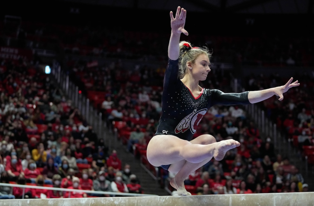 (Francisco Kjolseth | The Salt Lake Tribune) Utah’s Grace McCallum spins on the beam during their gymnastics meet with Stanford at the Huntsman Center in Salt Lake City, Saturday, Jan. 29, 2022.