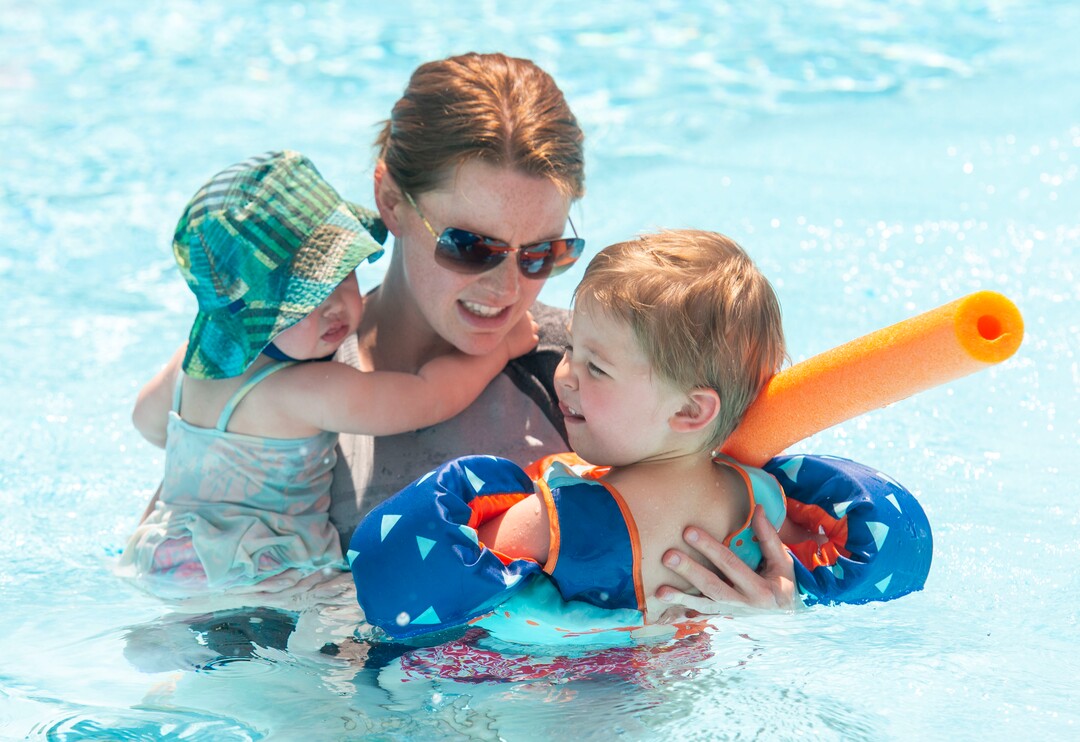 (Rick Egan  |  The Salt Lake Tribune)    Kaitlyn Curtis swims with Ada and Theo at the Jewish Community Center, May 31, 2019