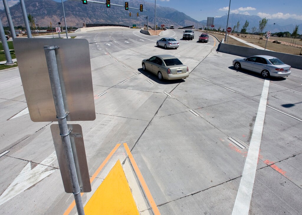 (Steve Griffin | Tribune file photo) Pioneer Crossing, a major new road that features the state's first "diverging diamond" interchange, pictured here at I-15, opened in American Fork on Monday, August 23, 2010. The road runs from I-15 to Redwood Road in Saratoga Springs. Pioneer scenes are depicted on the sound walls at most of the major intersections.