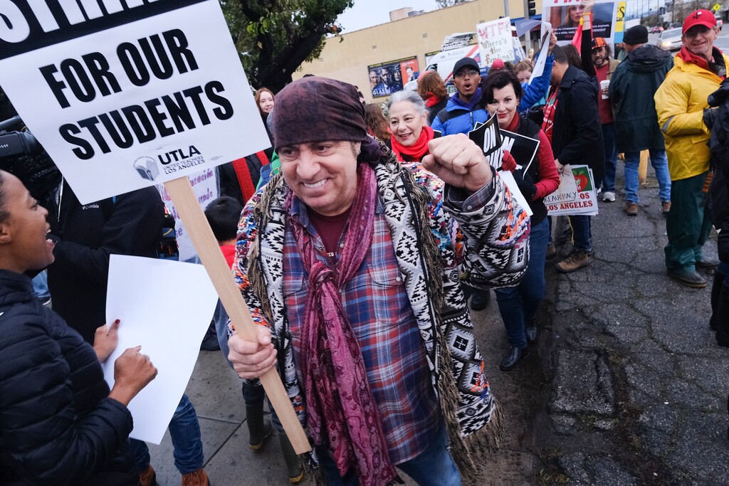 Actor, musician and activist, Steven Van Zandt supports striking teachers on the picket in front of Hamilton High School in Los Angeles on Wednesday, Jan. 16, 2019. School administrators urged the union to resume bargaining as tens of thousands of teachers planned to walk picket lines for a third day Wednesday. (AP Photo/Richard Vogel)