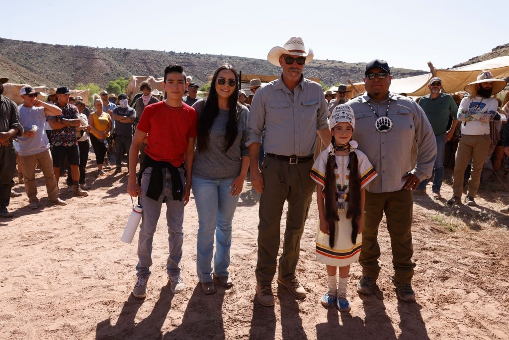 (Fred Hayes | St. George News) The Duran family visits the set, on location near St. George, Utah (L to R) Tyson Ali Duran, Reegan Duran, Kevin Costner, Ava Duran, Paiute Restoration Pow Wow Princess 2023-24, and Travis Duran, Shivwitts Reservation Land Resource Manager, Ivins, Utah, unspecified date.