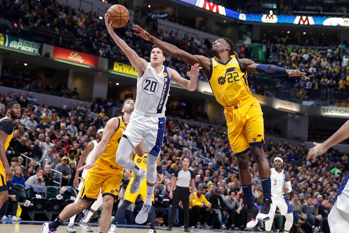 Indiana Pacers forward Doug McDermott (20) shoots in front of Utah Jazz forward Jeff Green (22) during the first half of an NBA basketball game in Indianapolis Wednesday, Nov. 27, 2019. (AP Photo/Michael Conroy)