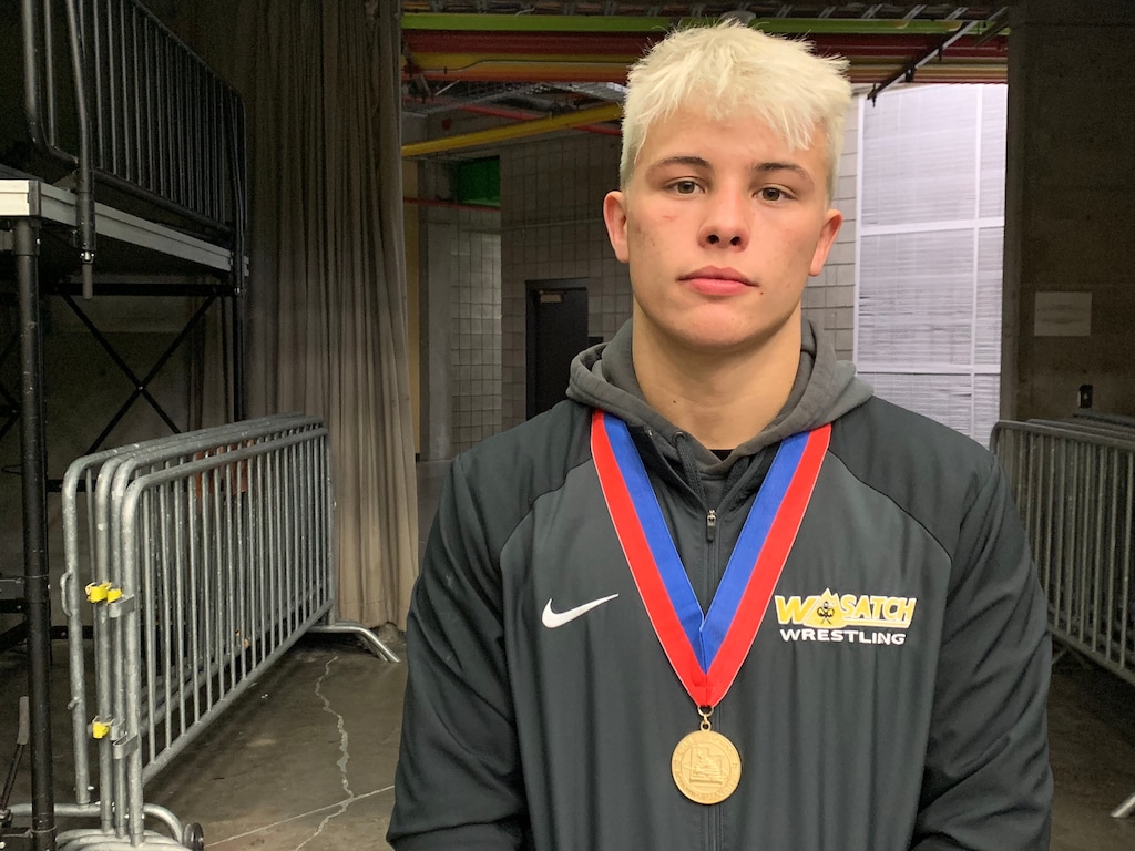 (Alex Vejar |  The Salt Lake Tribune) Wasatch High senior Zak Kohler holds his medal after winning his fourth consecutive 5A state wrestling championship on Thursday, Feb 14, 2019 at the UCCU Center of Utah Valley University.