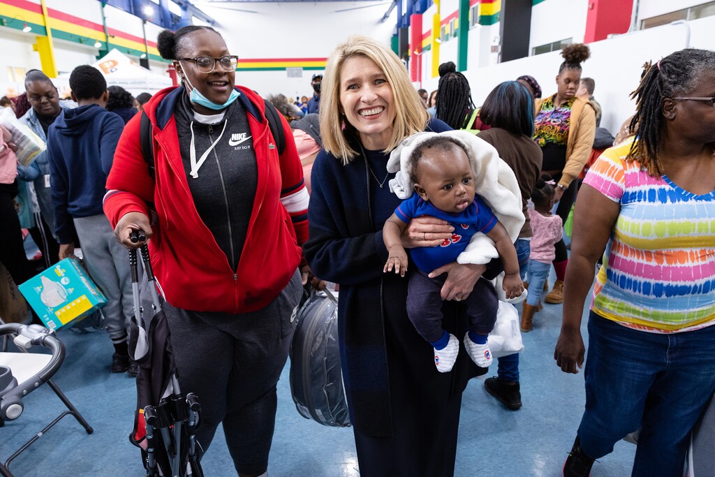 (The Church of Jesus Christ of Latter-day Saints) President Camille N. Johnson, center, helps care for baby Dayne while his mother, Antshamonay Jackson picks free baby essentials during the Chicago Citywide Community Baby Shower on Nov. 5. 2022. Johnson, who leads the church's global Relief Society, is an accomplished attorney.