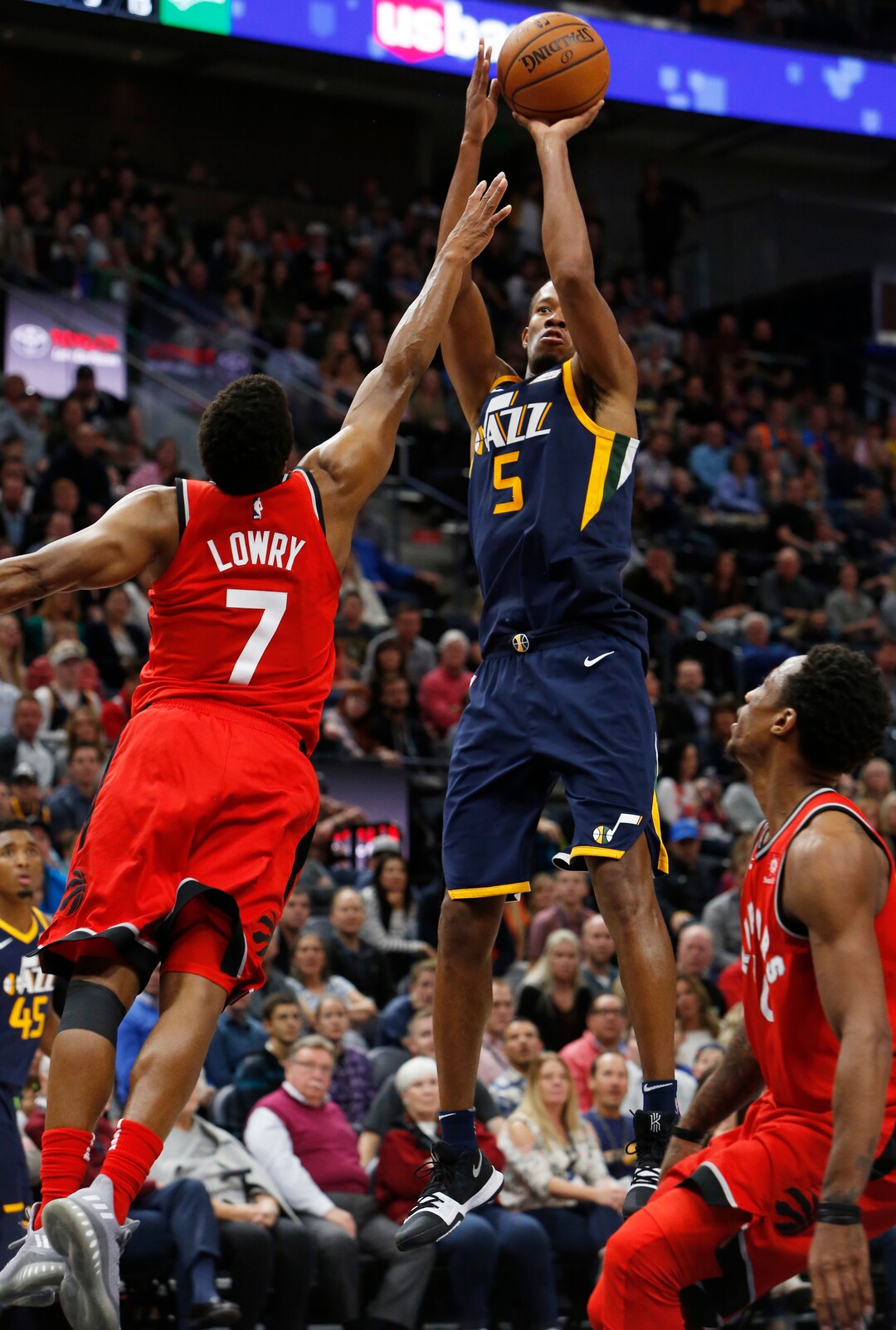 Utah Jazz's Rodney Hood (5) shoots as Toronto Raptors' Kyle Lowry (7) defends during the second half of an NBA basketball game Friday, Nov. 3, 2017, in Salt Lake City. The Raptors won 109-100. (AP Photo/Kim Raff)