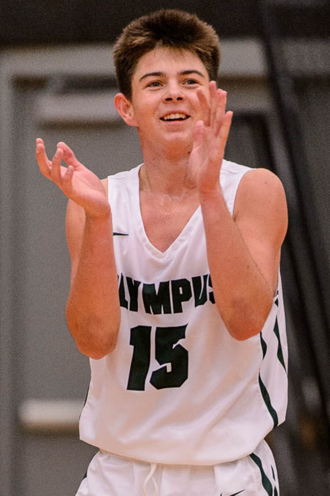 (Trent Nelson | The Salt Lake Tribune)  Olympus's Rylan Jones celebrates a double-digit lead as American Fork hosts Olympus in the Utah Elite Eight tournament, Saturday December 9, 2017.
