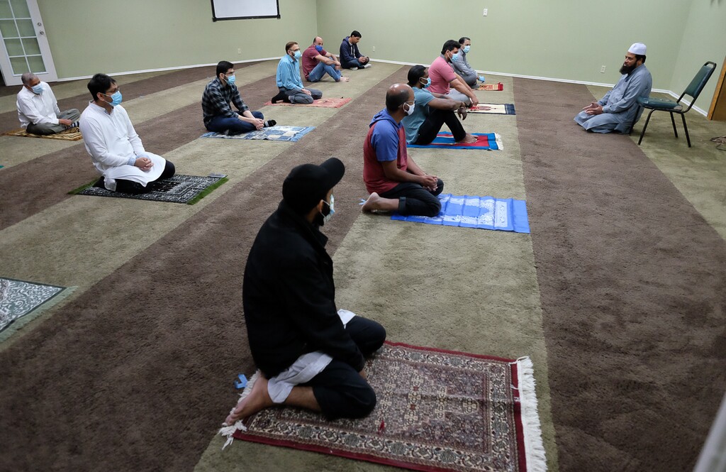 (Francisco Kjolseth | Tribune file photo) Imam Shuaib Din of the Utah Islamic Center in Sandy holds 10-minute prayers with increased spacing for the first time on Friday, May 8, 2020, since closing down for the coronavirus pandemic. President Donald Trump has declared that all religious services are "essential."