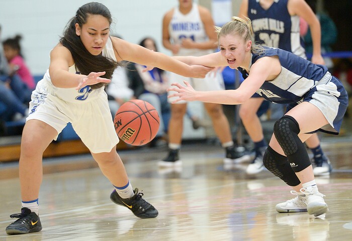 (Leah Hogsten  |  The Salt Lake Tribune) Bingham's Meleane Lokotui (23) and Copper Hills' Amberly Lazenby (01) scramble for the ball.  Bingham faces Copper Hills in their semifinal game of the 6A High School Girls' Basketball Tournament at SLCC in Taylorsville, Friday, Feb. 23, 2018. 