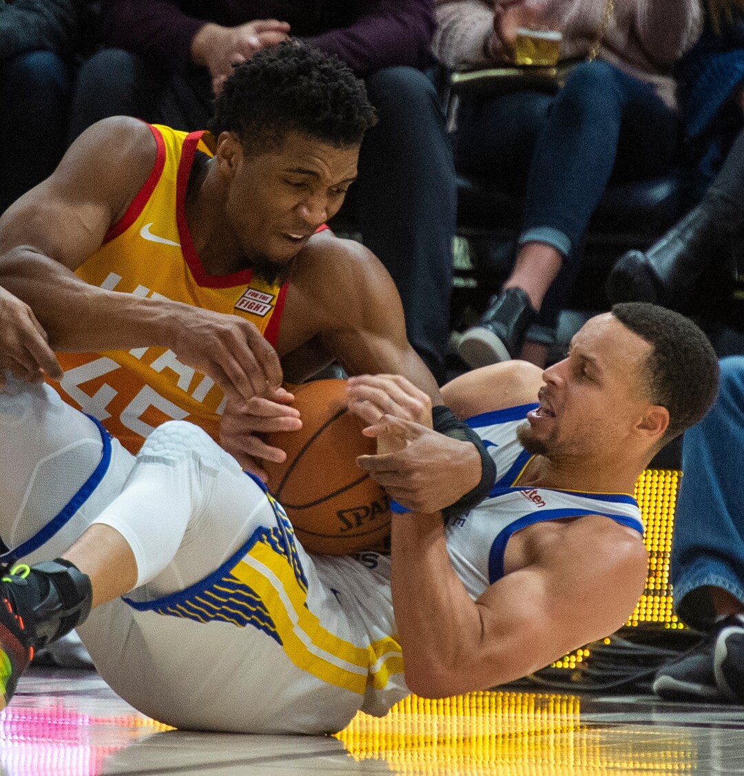(Rick Egan  |  The Salt Lake Tribune)  Utah Utah Jazz guard Donovan Mitchell (45) goes for a loose ball along with Golden State Warriors guard Stephen Curry (30), in NBA action between Utah Jazz and Golden State Warriors, in Salt Lake City, Wednesday, Dec. 19, 2018.