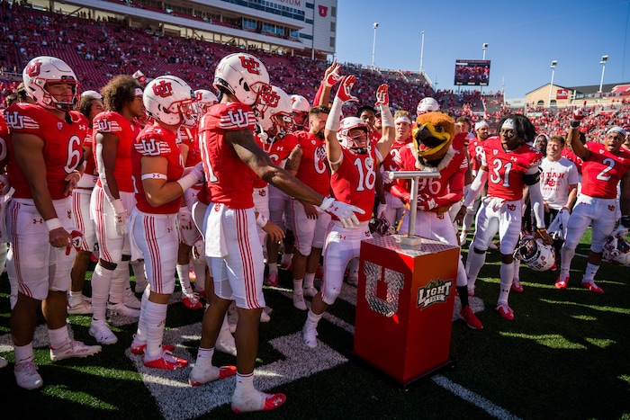 (Trent Nelson  |  The Salt Lake Tribune) Utah Utes wide receiver Britain Covey (18) and teammates celebrate as the University of Utah hosts Washington State, NCAA football in Salt Lake City on Saturday, Sept. 25, 2021.