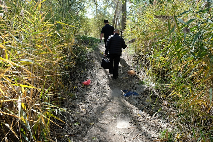 (Francisco Kjolseth  |  The Salt Lake Tribune)  Patrick Rezac, Executive Director of One Voice Recovery and Alex Larson visit a transient camp along the Jordan River to offer support only to find the camp had been recently dismantled. In an effort to curb the incidents of hepatitis C, HIV and STD's, the grass roots team hands out disease prevention kits and provides a needle exchange program.