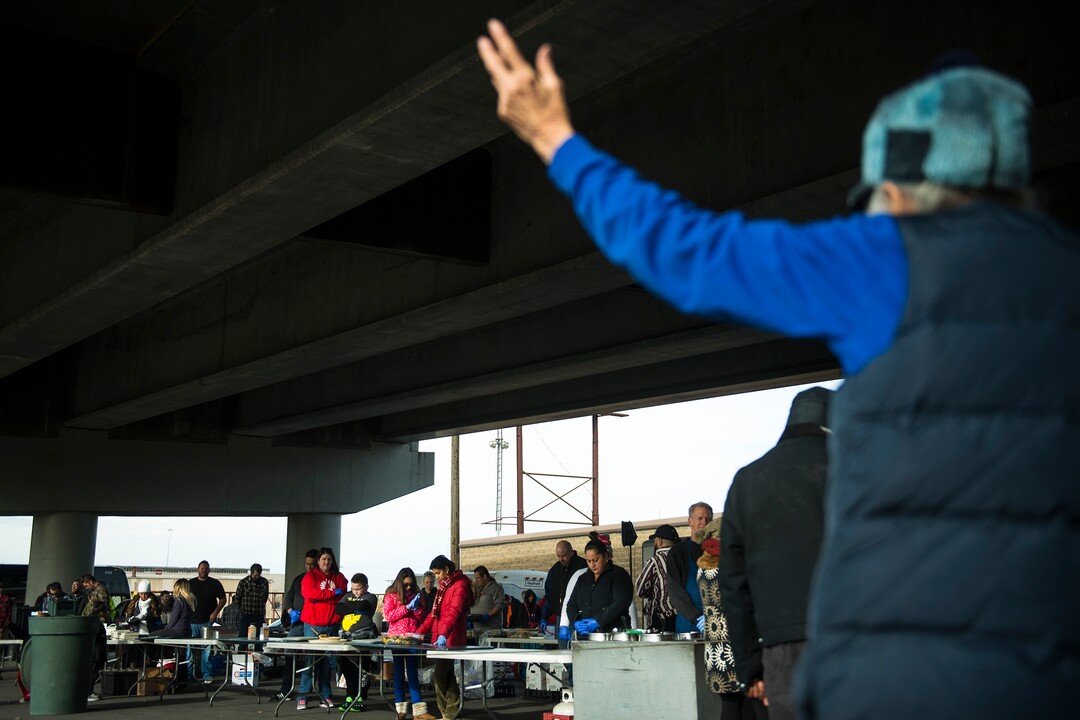 (Chris Detrick  |  The Salt Lake Tribune)  Eagles Ranch Ministries founder Jennie Dudley prays before serving Thanksgiving Day meals during the Eagle Ranch Chuckwagon under the viaduct at 500 South and 600 West in Salt Lake City Thursday, November 23, 2017.  