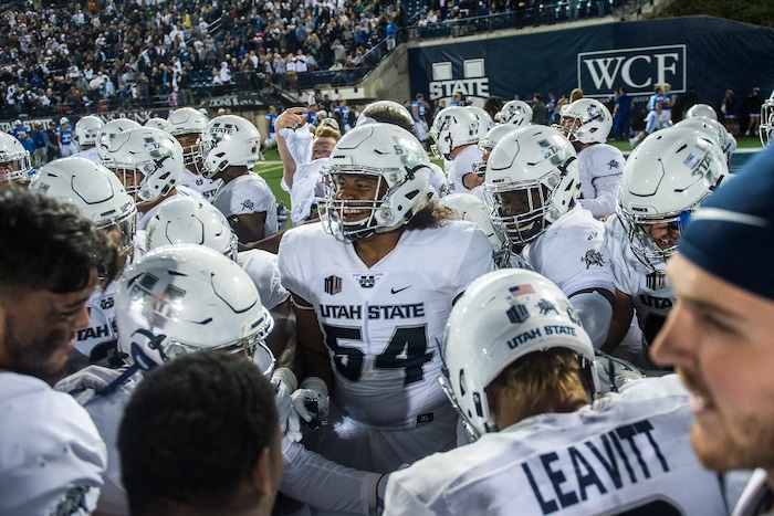 (Chris Detrick  |  The Salt Lake Tribune)  Utah State Aggies defensive lineman Nami Tuitu'u (54) celebrates with his teammates after the game at Merlin Olsen Field at Maverik Stadium Friday, September 29, 2017. Utah State Aggies defeated Brigham Young Cougars 40-24.