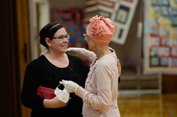 (Francisco Kjolseth  |  The Salt Lake Tribune)  Becky Thorpe, left, of Heber visits her former neighbor Nacele Hart who has made more than 100 quilts and numerous sewing projects over a 10-year period for her children, grandchildren and great-grandchildren. "You can feel the love and emotion and see the impact she's made," said Thorpe upon entering the gym at the ward house in Orem where the quilts were on display. 