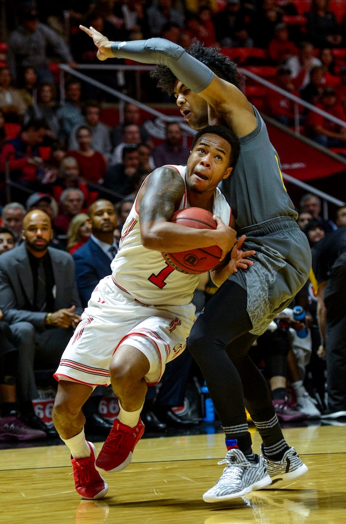 (Steve Griffin  |  The Salt Lake Tribune) Utah Utes guard Justin Bibbins (1) drives past Arizona State Sun Devils guard Remy Martin (1) during the Utah Utes versus Arizona State Sun Devils at the Huntsman Center on the University of Utah campus in Salt Lake City Sunday January 7, 2018.