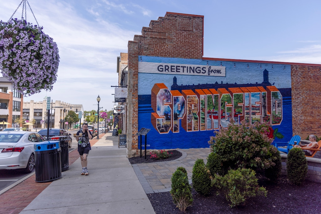 (Maddie McGarvey | The New York Times) A “Greetings from Springfield” mural in Springfield, Ohio, on Aug. 27, 2024. Faith leaders are rallying behind Haitian migrants after false claims made by former President Donald Trump.