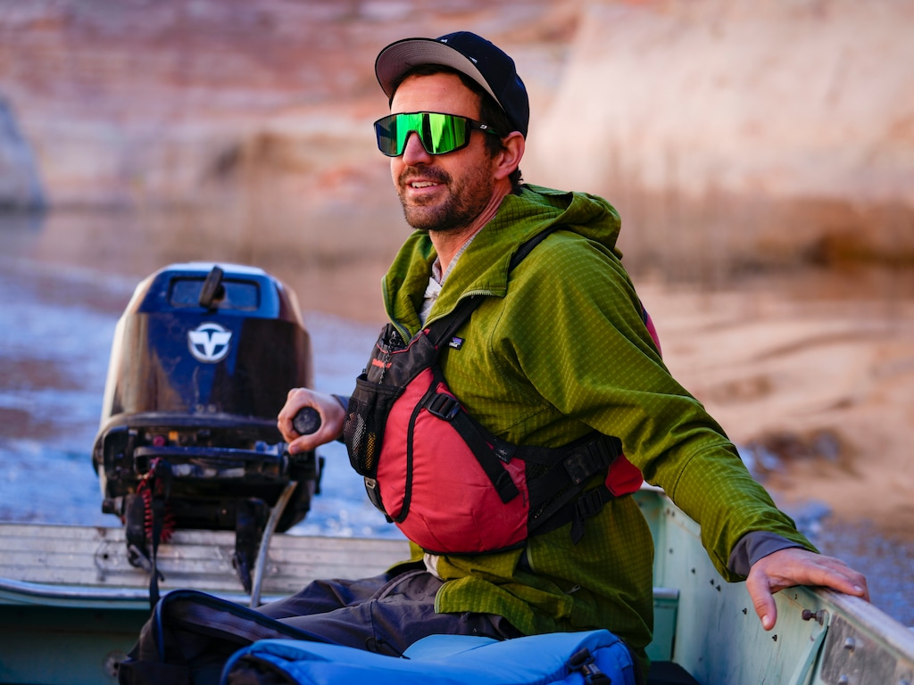 (Bethany Baker  |  The Salt Lake Tribune) Eric Balken, the executive director of the Glen Canyon Institute, boats through Davis Gulch during a trip to Lake Powell near Ticaboo, Utah on Tuesday, Oct. 17, 2023.