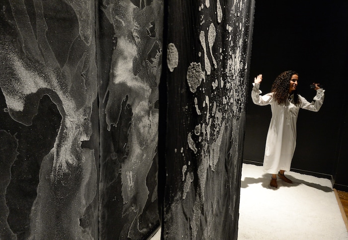 (Francisco Kjolseth | The Salt Lake Tribune) Artist Balqis Alrashed born in Riyadh, Saudi Arabia and raised in Beirut talks about her art installation using salt water from the Great Salt Lake painted on black cotton that is part of a new exhibit at the Utah Museum of Contemporary Art's entitled "Cities of Conviction," with works of contemporary art by artists from Saudi Arabia.