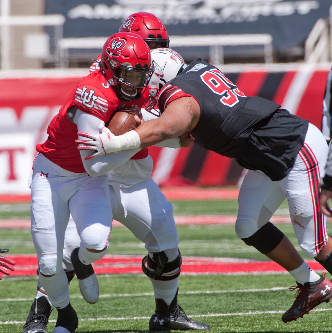 (Ed Kosmicki | Special to The Tribune) The red team QB Ja'Quinden Jackson #3 picks up some tough yards during the annual spring football game at the University of Utah, 17 April 2021.