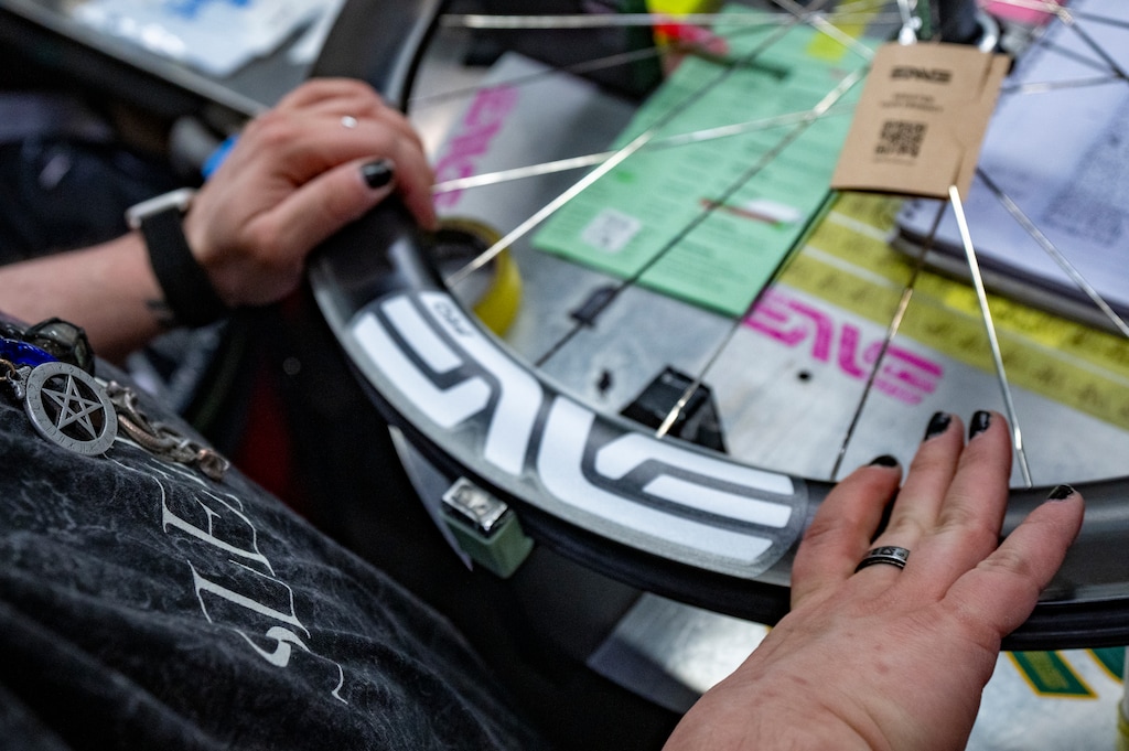 (Rick Egan | The Salt Lake Tribune) Decals are applied to a wheel at the ENVE Composites facility on Tuesday, July 7, 2026.
