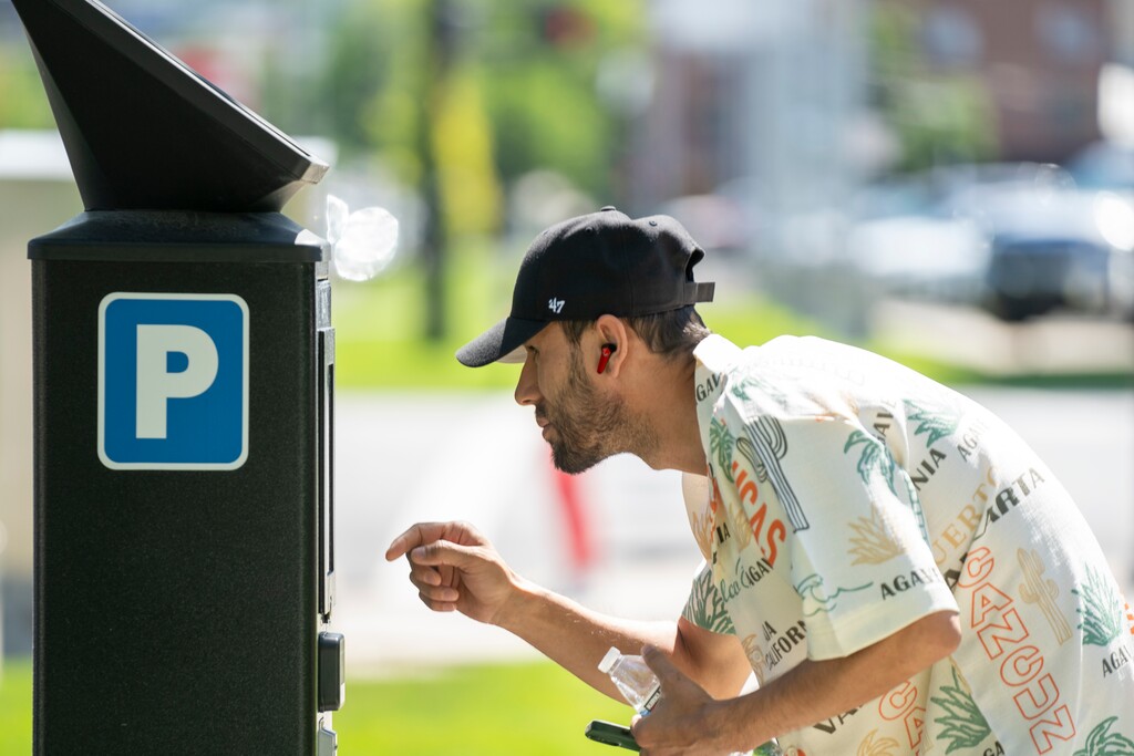 (Rick Egan | The Salt Lake Tribune) Rashid Abdul pays for parking at a kiosk on 500 South on Wednesday, June 4, 2025.

