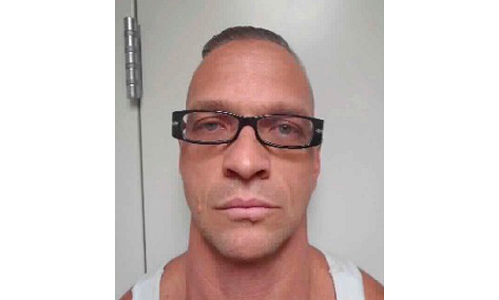 FILE - This undated file photo provided by Nevada Department of Corrections photo shows death row inmate Scott Raymond Dozier, who was convicted in 2007 of robbing, killing and dismembering a 22-year-old man in Las Vegas, and was convicted in Arizona in 2005 of another murder and dismemberment near Phoenix. Dozier whose execution has twice been postponed says Wednesday, Aug. 8, 2018, the legal fight over his fate is taking a tortuous toll on him and his family and he just wants his sentence carried out. (Nevada Department of Corrections via AP, File)
