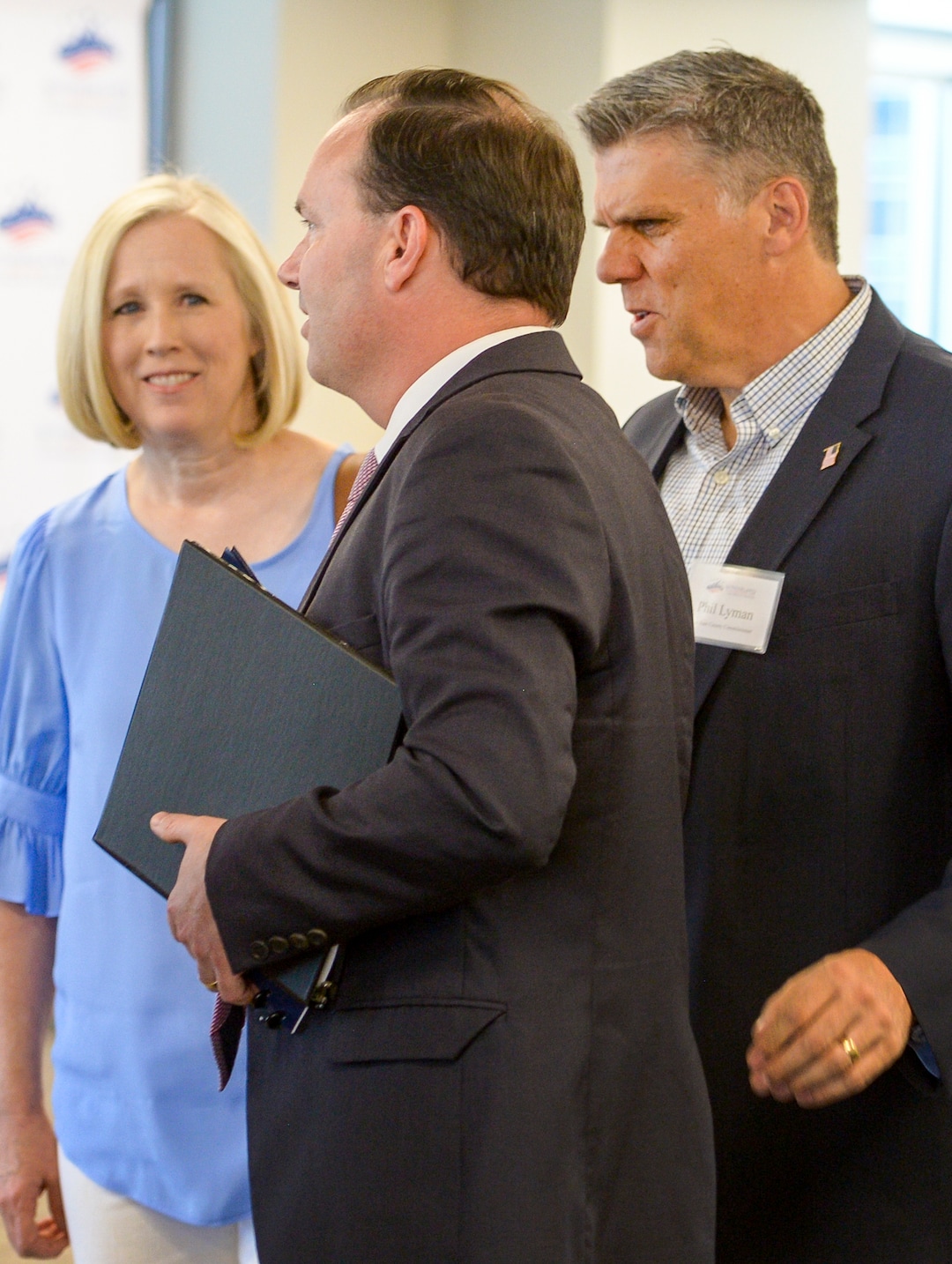 Leah Hogsten  |  The Salt Lake Tribune  Sen. Mike Lee talks with San Juan County commissioner Phil Lyman and his wife, Jody, before Lee took the podium to talk about Utah's public lands at a forum hosted by the Sutherland Institute, June 29, 2018.