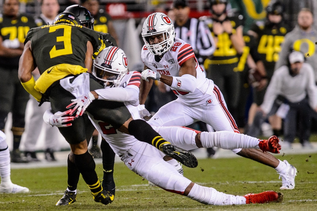 (Trent Nelson  |  The Salt Lake Tribune) Utah defensive back Julian Blackmon (23) tackles Oregon Ducks receiver Johnny Johnson III (3) for a loss on the Ducks' first offensive play of the Pac-12 championship game last Friday at Santa Clara, Calif.