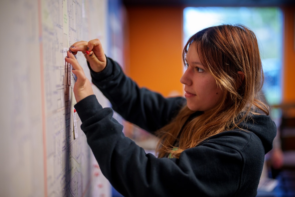 (Trent Nelson  |  The Salt Lake Tribune) Alice Tarnawiecki tags a location as part of a project to have people create a "treasure map" — “a mapa de nuestros tesoros” — of significant west-side locations, at Mestizo Coffeehouse in Salt Lake City on Wednesday, Nov. 2, 2022.