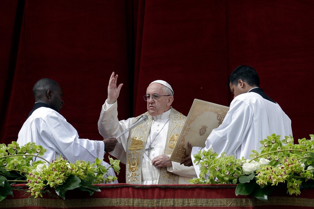 (AP Photo/Andrew Medichini) Pope Francis delivers the Urbi et Orbi (to the city and to the world) blessing at the end of the Easter Sunday Mass in St. Peter's Square at the Vatican, Sunday, April 1, 2018.
